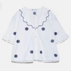 OPENWORK EMBROIDERED BLOUSE V-neckline and below-the-elbow length sleeves.